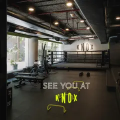 A stylized shot of our gym floor, featuring the boxing ring and agility hurdles. This is where you come to work. See you at Knox.