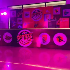 Themed decor elements for the ITC 'Sports Box' event. This branded counter and backdrop served as a central hub for the party's activities.