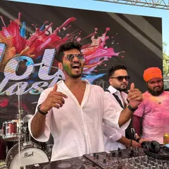 The 2025 Holi party was a blast of colors and energy. This shot captures me hyping up the crowd, with everyone covered in colors and having an amazing time.