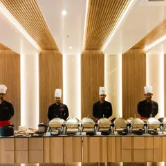 We pride ourselves on elegant and professional buffet presentations. Here is a full dinner setup at Prestige Primrose Hills, showcasing our clean, organized catering line ready for service in a modern clubhouse setting.