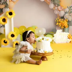A little taste of the birthday cake! I love capturing these spontaneous, sweet moments during a first birthday cake smash. This sunflower theme was so bright and cheerful.