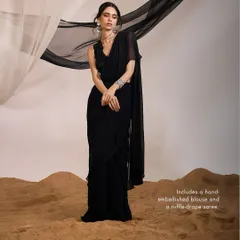 The Eve Saree Set, a fashion-forward piece that includes a hand-embellished V-neck blouse and a modern ruffle-drape saree.
