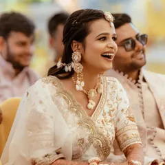 A candid moment of laughter, showing how the makeup stays perfect even during the most joyous moments.