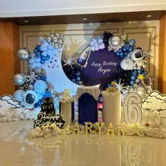 For the little astronaut, this outer space theme is a blast! I created a complete galaxy experience with a crescent moon backdrop, planet and rocket balloons, astronaut cutouts, and cloud-like floor decor to make Aryan's 6th birthday truly out of this world.