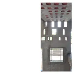 This is the 'Wall of Light' at the Mahesh Residence, seen here during construction. The angular punctures are designed to create a dynamic play of light inside. This image shows the raw form of a feature that will become a defining element of the home's atmosphere.