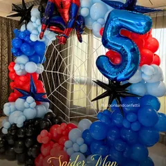 I love bringing a child's favorite hero to life. This Spider-Man themed 5th birthday party features a dynamic balloon arch in classic red, blue, and black, complete with a spider web backdrop and a giant number '5' balloon. It’s all about creating that 'wow' moment for the kids.