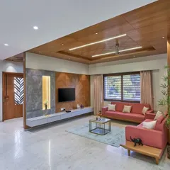 This living room combines warm wood ceilings with soft, comfortable furnishings. I designed the space to feel open yet cozy, with a custom media wall that is both functional and a beautiful focal point.