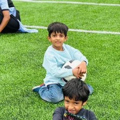 A new journey begins. Students enjoying a break on the field, building friendships and memories on their first day at Ekya Nava.