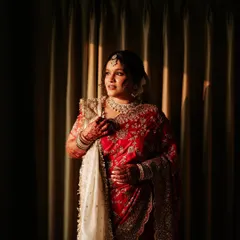 Another shot of the bride getting ready, capturing the serene moments before the ceremony.