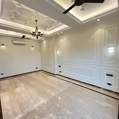 Look at the sheer scale and elegance here. The polished Italian marble floors reflect the light beautifully from the classical false ceilings. I design these spaces to be a perfect canvas for you to create your life's best memories.