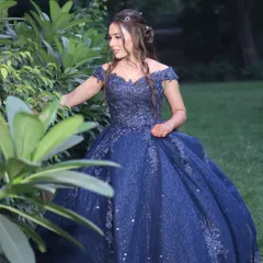 Another shot of this gorgeous engagement look. The off-the-shoulder gown is complemented by loose, flowing curls and elegant makeup.