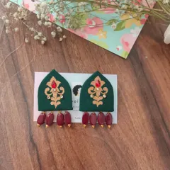 These hand-painted earrings are shaped like traditional arches and feature intricate designs with bead drops. They are available in both green and red, perfect for festive or wedding attire.