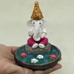 This is one of my favorite pieces to create. A miniature Ganesha, hand-sculpted from polymer clay, finding his peace in a serene lotus pond. Each tiny petal and the calm water effect is crafted to bring a sense of tranquility to your home.