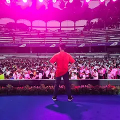 From the office floor to the stadium stage, we bring the same level of energy. Here I am, looking out at a massive crowd, ready to lead a high-energy Zumba warm-up. We handle events of all sizes with confidence and passion.