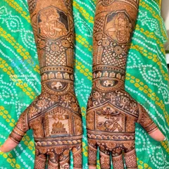 A design filled with spiritual significance. This mehndi features portraits of Lord Krishna and Meera Bai on the forearms, with a havan kund (sacred fire) and a tulsi plant on the palms, representing devotion and purity.