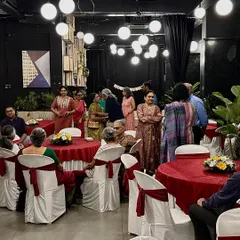 Hosting an event where everyone has a good time. This image shows guests mingling and enjoying themselves at a party in one of our indoor spaces.