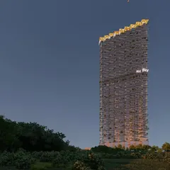 The "Ah! Sky!" tower at dusk. The 52 storey project, with its rich mix of retail and restaurants, is designed to be a landmark. The unique silhouette and illuminated crown make it a beacon in the city skyline.