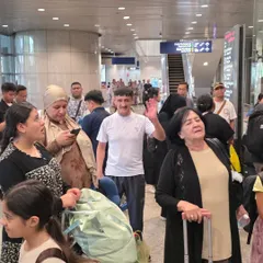 A candid moment at the airport with other teams. Traveling for competitions helps our students build friendships with martial artists from around the world.