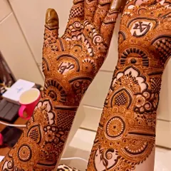 This design for bride Gulshan features her and her partner's initials hidden within the intricate patterns. It's a subtle and personal touch that makes the mehendi extra special.