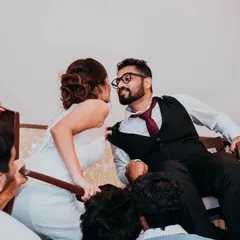 A playful moment during the reception, where the bride and groom are lifted on chairs for a traditional Jewish wedding dance, the Hora. We love capturing these unique cultural celebrations.