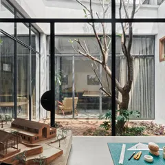 A view from our model room, looking through the courtyard into other office spaces. The use of large glass windows creates a sense of connectivity and transparency throughout the studio.