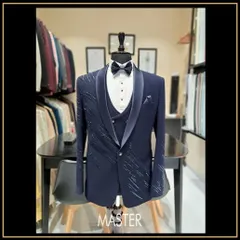 For the groom who wants to make a statement. This navy blue three-piece tuxedo features a unique shawl lapel and delicate crystal work, designed to make your special day even more memorable.