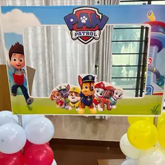 A custom Paw Patrol photo booth frame. These are always a hit with kids and adults, providing a fun, interactive element for your party photos.