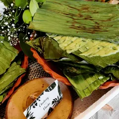 This is our Chutney Panki, a delicate and healthy Gujarati snack. A thin rice flour batter is steamed between banana leaves, making it a light and flavourful addition to any chaat party.