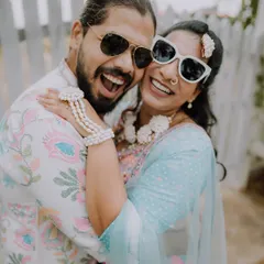 A joyful, sun-kissed hug. The energy and happiness of a Haldi ceremony are perfectly captured in this candid shot.
