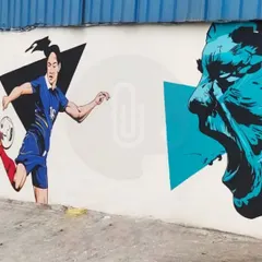 A section of a long mural for a football ground in Gurgaon, featuring dynamic illustrations of players in action. The graphic style and geometric shapes add to the sense of movement.