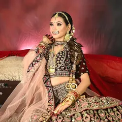 A classic bridal portrait, with the model looking radiant. The focus is on the complete look, from the jewelry to the elegant pose.