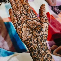 A beautiful, detailed design on a single hand. This is a great option for someone who wants an intricate pattern without full coverage.