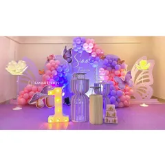 A magical butterfly theme for a first birthday, featuring a large light-up number one and glowing butterfly wings.