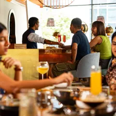 Whether you're at a table with friends or pulling up a seat at the bar, the atmosphere is always buzzing. It's a space designed for good food and even better company.