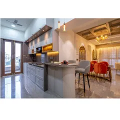 This open-concept design seamlessly connects the kitchen, breakfast bar, and dining area, creating a fluid and social heart of the home. We focused on a sophisticated grey palette, layered lighting, and high-end finishes to merge functionality with timeless style.