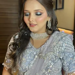 A close-up of the sangeet night glam, showing the detailed silver and blue smokey eye makeup.