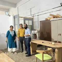 Happy clients at the workshop, checking out their new dining table before delivery. Seeing the satisfaction on a client's face is the best part of my job.