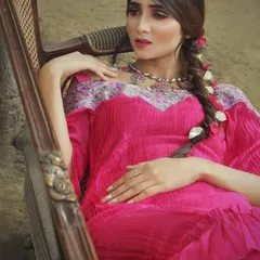 This fuchsia pink pleated maxi dress features an off-shoulder neckline with a contrasting floral embroidered yoke. It’s a perfect example of my indie-chic style, combining comfortable, modern design with intricate, traditional details.