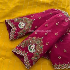 A close look at the detailed handwork on the elbow-length sleeves of a magenta raw silk blouse. This is my signature jewellery concept, where zardosi, kemp stones, and beadwork are combined to mimic the grandeur of a traditional necklace.