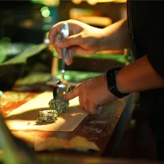 The art of making ravioli, shown here as our chef carefully places a dollop of spinach and ricotta filling onto a freshly rolled sheet of pasta. This hands-on process is part of the authentic Italian catering we provide.