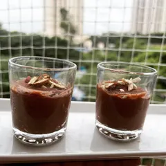 My plant-based chocolate mousse is perfect for all ages, including kids. Made with sweet potato and cacao, it's a delicious and healthy dessert served in individual glasses and topped with slivered almonds.