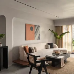 Natural light floods this living room, highlighting the soft texture of the boucle sofa and the clean lines of the custom furniture. I design spaces that feel both sophisticated and comfortable, perfect for everyday living.