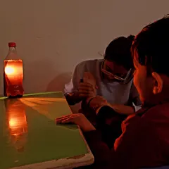 A dimly lit session using a simple light source inside a bottle. This activity helps a child with visual tracking and focus in a low-stimulation environment, ideal for those sensitive to bright lights.