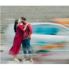 A fleeting kiss against the motion of the city. I use techniques like motion blur to freeze a moment of intimacy amidst the hustle, making it feel like you're the only two people in the world.