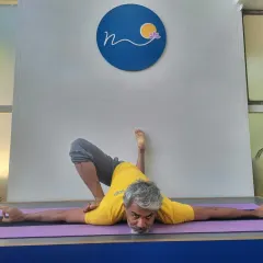 This hip-opening posture, a variation of Parsva Bhuja Dandasana, targets deep external rotation of the hip. In my workshops, I guide students on how to safely enter such poses to increase mobility and release tension.