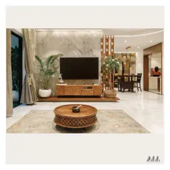 We created a showstopper living room with this contemporary TV unit. The design combines the richness of a carved wood console with the timeless luxury of a full-height marble backing, perfectly capturing the Indo-Contemporary aesthetic our client desired.