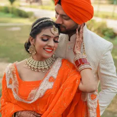 A tender moment during a pre-wedding shoot. The groom's gentle kiss on the bride's forehead shows their deep affection, and her happy expression says it all. This is the kind of genuine emotion I love to capture.