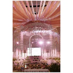 A floating floral flair. This central installation of cascading pink and orange ribbons created a stunning visual centerpiece for an expansive dining hall.