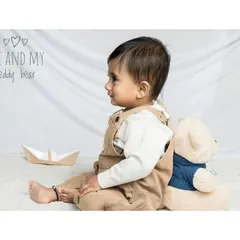 A quiet moment with a best friend. This portrait of a baby and his teddy bear has a classic, nostalgic feel that you'll treasure for years to come.