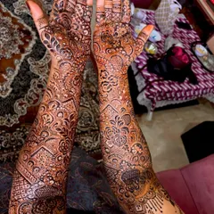 This photo showcases the beautiful dark stain of a full bridal henna design. The color is rich and even, a sign of high quality, natural henna.